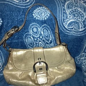 Beautiful shoulder gold coach bag